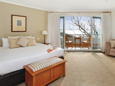 beige hotel room and balcony
